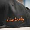 ELPASO BOOTMAKERS BLACK CLOVER SNAP BACK HAT